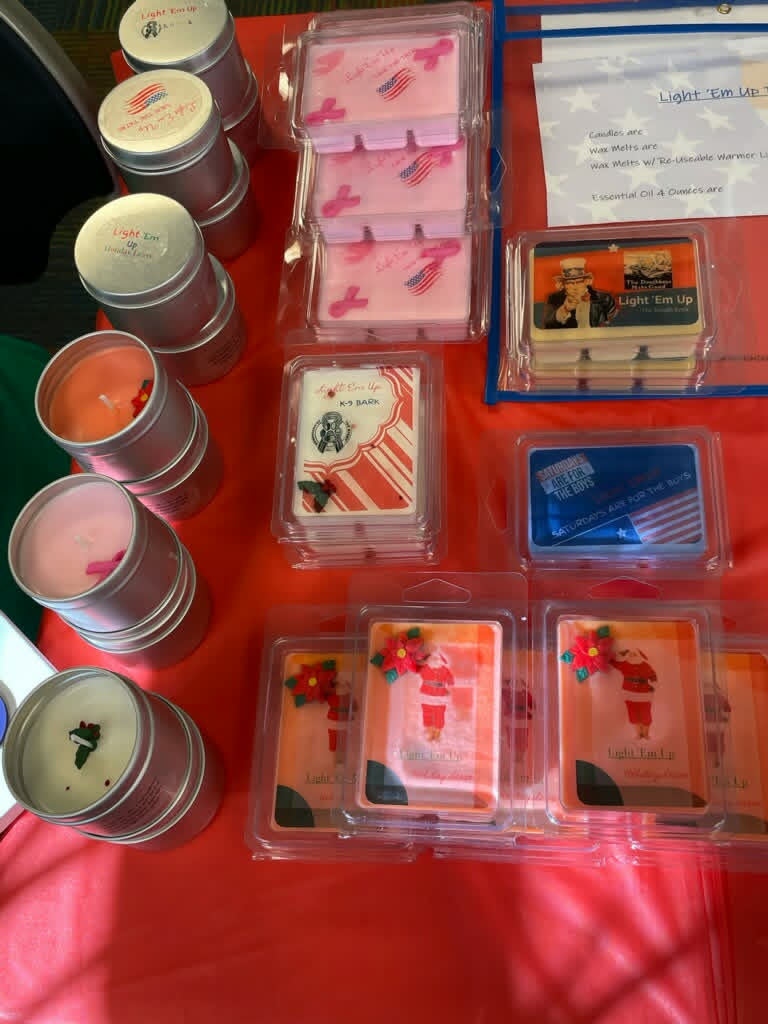 Light Em Up products displayed at a community market